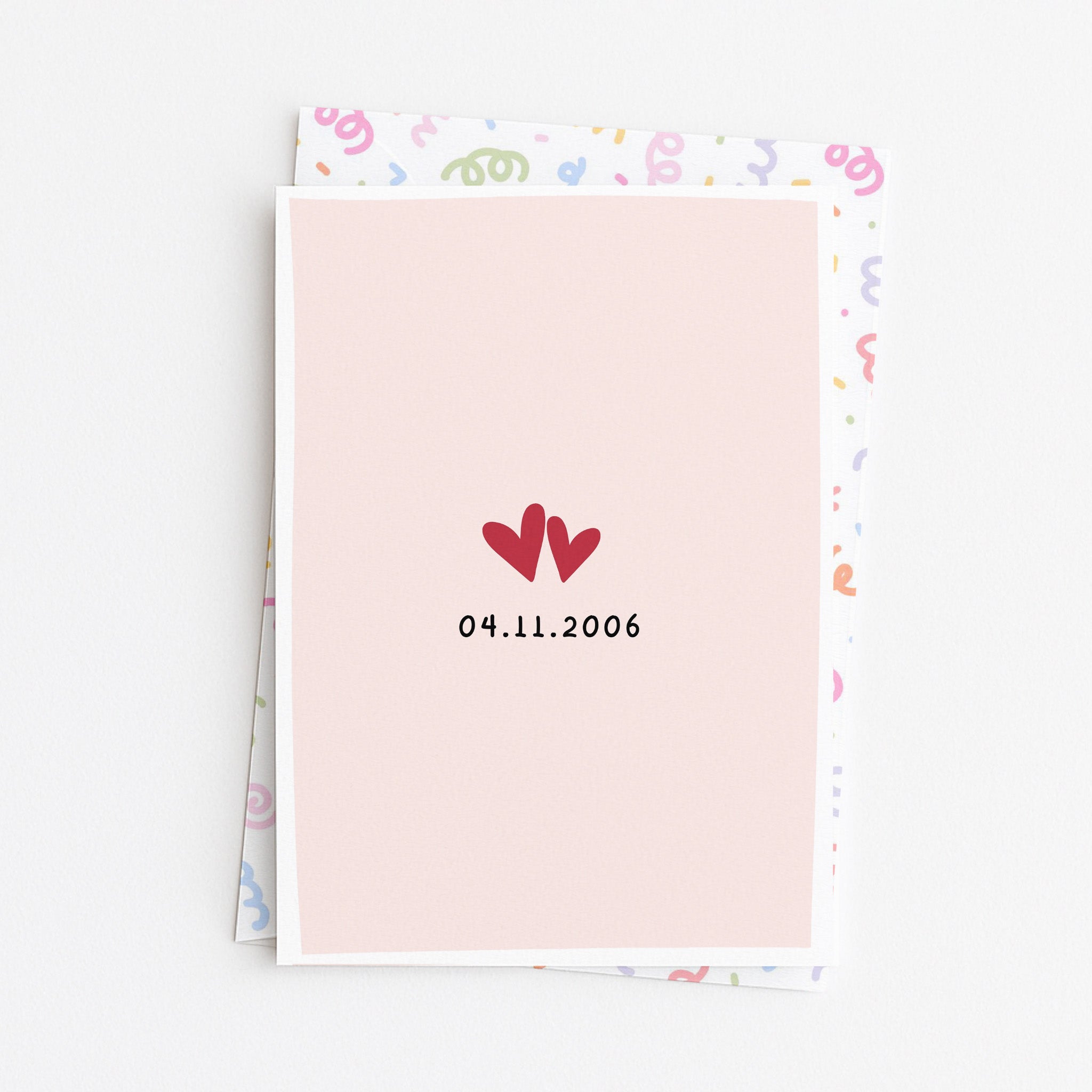 Close up of anniversary love date greeting card front design with envelope background